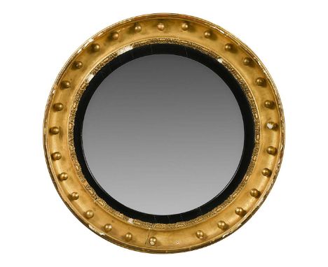 A large Regency convex wall mirror, with repeating ball moulding75cm diameterA later replacement plate in the centre