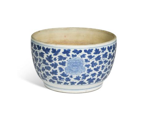 A Chinese blue and white porcelain bowl, Qing Dynasty, 18th century, painted with an all over lush pattern of peony heads wit