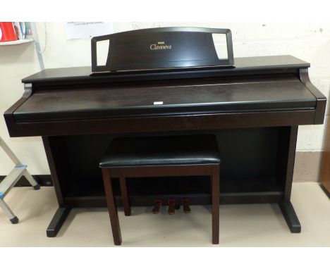 A full size Yamaha Clavinova CLP 511 self-tuning electric digital piano with matching stool