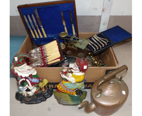 A pair of cast iron Punch & Judy doorstops; a set of brass postage scales and weights; silver plated cutlery and metalware