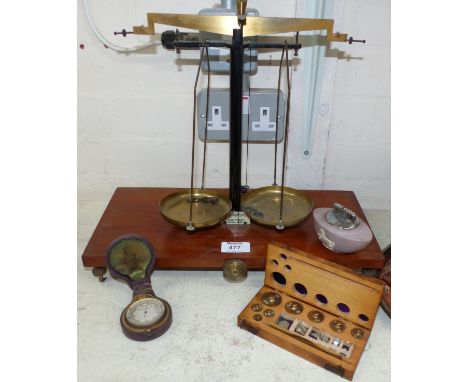 A 19th century pocket barometer in case; a pair of brass scales and weights