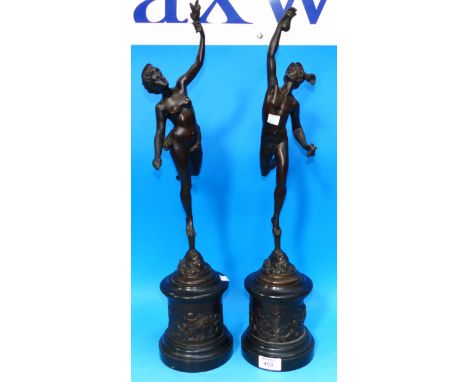A pair of bronze classical figures of Mercury and Venus, on polished black marble bases with cast panels of putti, 23"