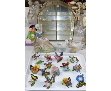 Three Nao figures and a similar figure; a collection of bisque butterflies in miniature brass display case; a Rington's butte