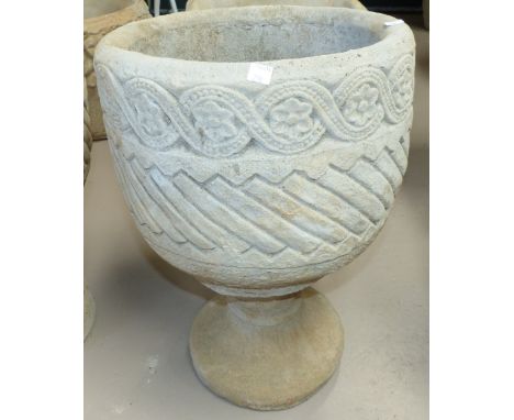 A modern circular Aztec design garden planter