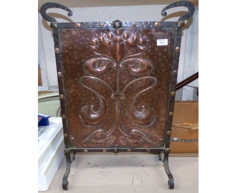 An Art Nouveau embossed copper firescreen; a 19th century copper warming pan
