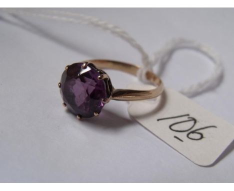15ct god ring mounted with a   circular purple stone approx size M     