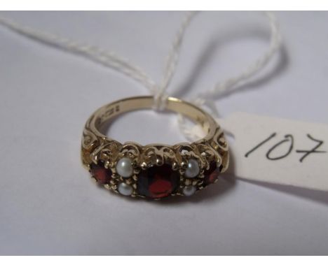 A fancy carved pearl & garnet 9ct  ring approx size M       