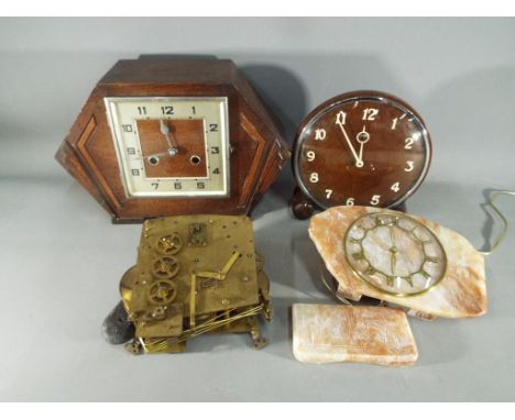 A box containing clocks and clock parts.