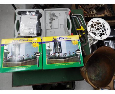 A good mixed lot to include two sets of LUX garden lighting in original box, an 18 V performance cordless hammer drill with r
