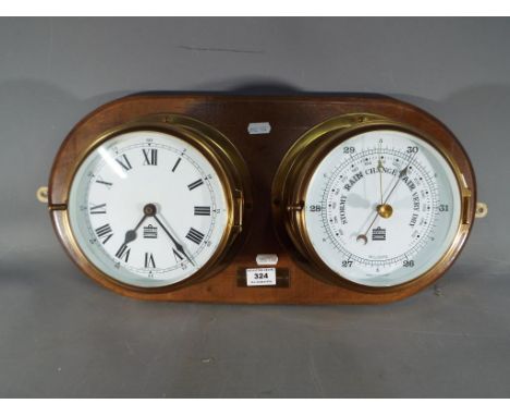 A Sewills Liverpool brass cased ships bulkhead clock and barometer, on wooden mount, approx 16.5 cm diameter clock and barome
