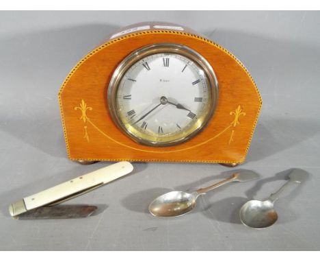 A wooden inlaid 8 day wind clock, a vintage pocket knife with blade marked Saynor Cooke &amp; Redal and two white metal teasp