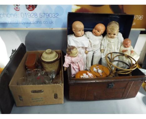A mixed lot to include a metal trunk, bevel edged wall mirror, vintage dolls, glassware, cased Zenith binoculars and similar.