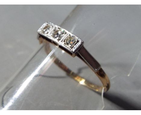 An 18 carat gold trilogy ring with triple diamond set, size Q, approximate weight 1.89 gramsCondition - no signs of chipping 