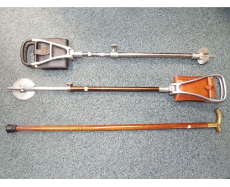 Two adjustable shooting sticks including one by Gamebird and a brass handled walking stick.