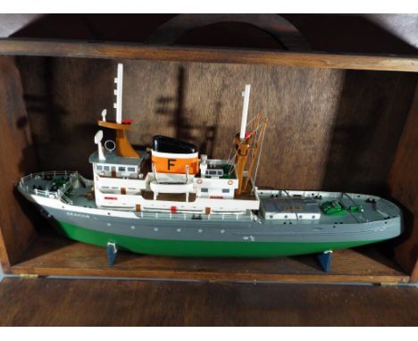 A scratch built model ship contained in case and a vintage suitcase. [2]
