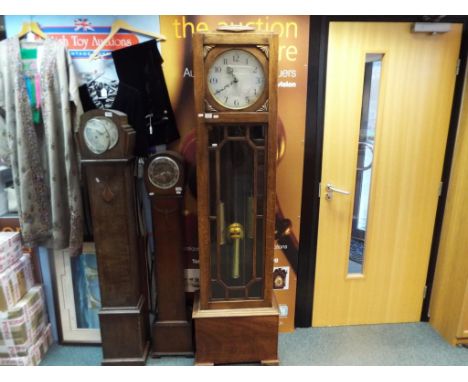 An oak cased Enfield long case clock, Arabic numerals, with weights and pendulum, approximately 196 cm (h)