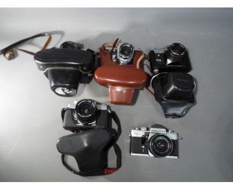 Photography - a collection of vintage 35 mm SLR film cameras to include Praktica Super TL, Fujica ST701, Praktica MTL3 and si