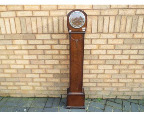An oak cased granddaughter clock, Arabic numerals, Smiths movement, with key and pendulum, approximately 132 cm (h)