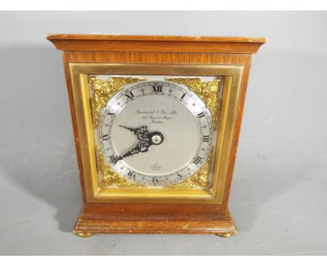 An Elliott mantel clock, retailed by Garrard &amp; Co Ltd, London.