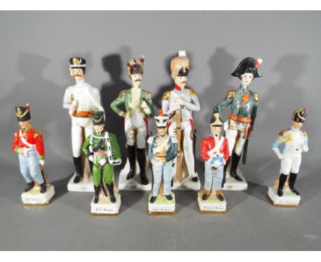 Nine ceramic figurines of military figures, largest approximately 23 cm (h)