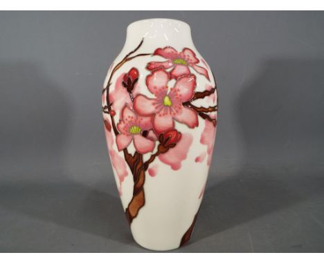 Moorcroft Pottery ceramic vase decorated in Confetti pattern with maker's mark to the base and measuring approximately 21 cm 