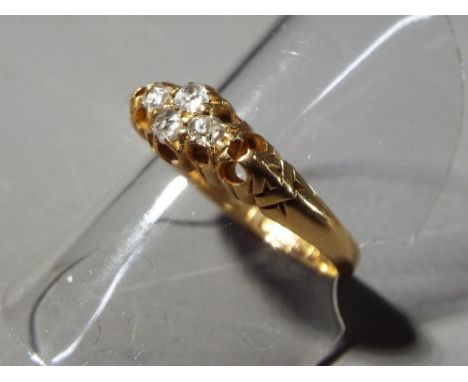 A lady's hallmarked 18 carat yellow gold ring set with four diamonds, size P+, approx weight 3.17 gm (all in)
