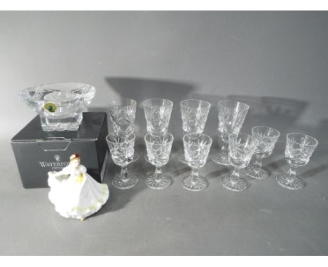 A boxed Waterford Crystal candle holder and a quantity of cut crystal glasses, also included in the lot is a Royal Doulton la