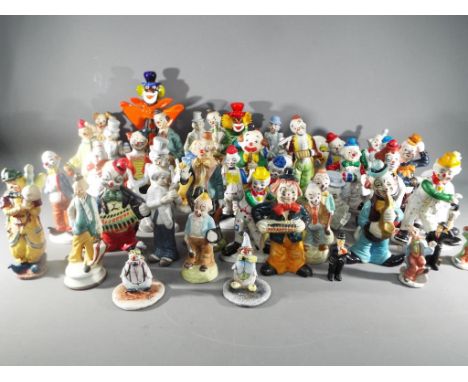 A large quantity of clown figurines to include ceramic, Murano style glass and similar.