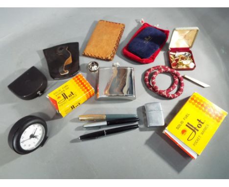 A good mixed lot to include a Zippo lighter 2032695, three Fountain pens to include a Parker and unmarked pen with platinum 4