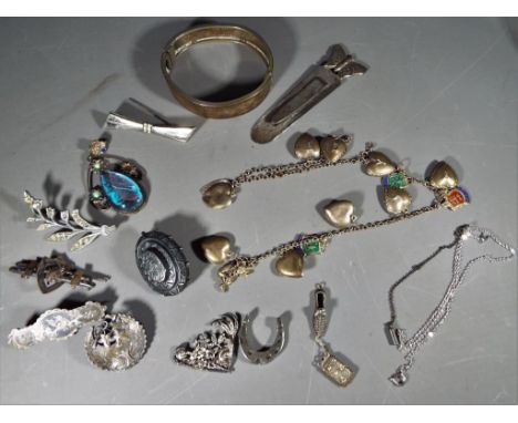 Silver - a mixed lot of Silver and white metal jewellery to include bangle, brooches, stone set pendant, bracelets and simila