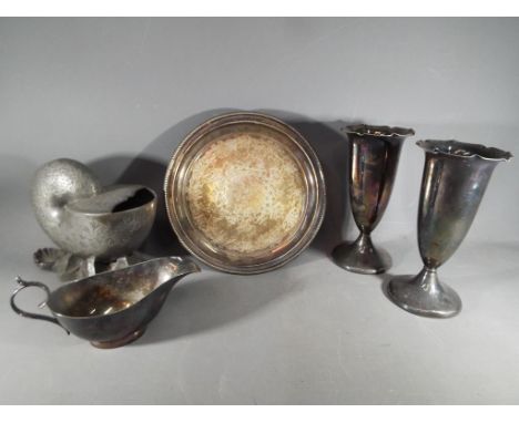 A collection of plated ware to include a salver / card tray, a William Hutton and Sons spoon warmer in the form of a shell, v