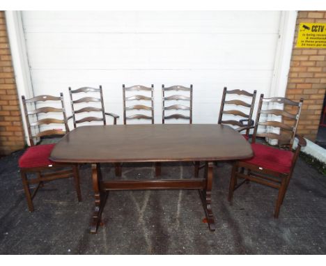 Ercol - a dining table, 72 cm x 153 cm x 77 cm and six ladder back dining chairs - this lot must be paid for and removed no l