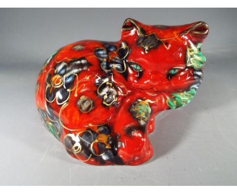 Anita Harris ceramic figurine of curled cat, measuring approximately 10 cm high and 13 wide.