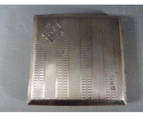 A George V silver hallmarked cigarette case with engine turned decoration, Birmingham assay 1929, approximately 125 grams.