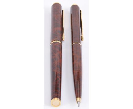 Parker, 95, a thuya lacque roller ball pen and propelling pencil, with gilt arrow clips