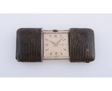 Unsigned,   Silver and leather mounted purse watch, circa 1927   Movement: Manual wind   Case: Silver sliding and leather mou