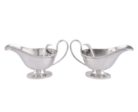 A pair of silver oval pedestal sauce boats by Horace Woodward &amp; Co., Birmingham 1920, 10cm (4in) high; an old English sau