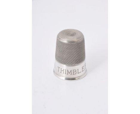 An Edwardian silver spirit measure fashioned as a thimble by Charles Horner, Chester, 1903 inscribed 'Just a Thimble Full', 5