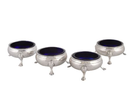 A set of four late George III silver cauldron salt cellars by Stephen Adams II, London 1810, each on three stepped pad feet, 
