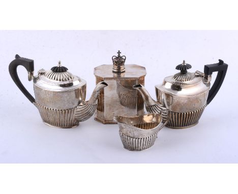 Two similar silver oval half reeded tea pots and a cream jug, differing makers, early 20th century, the tea pots with composi