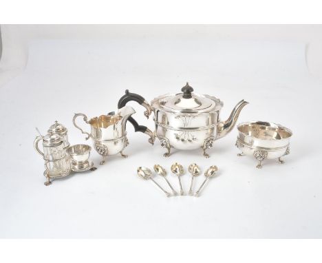 A silver shaped circular three piece tea service by Edward Barnard &amp; Sons Ltd, London 1926, the tea pot with a compositio