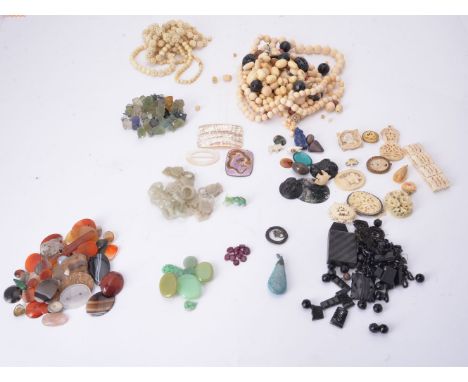 A collection of jewellery to include pale green jade carved and polished fragments, a jadeite elephant charm (damaged);  some