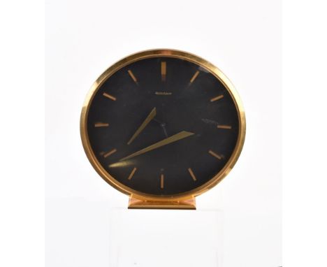 Jaeger LeCoultre, a gilt metal 8 day clock, circa 1960, black dial, applied baton markers, floating hands, 18.5cm diameter