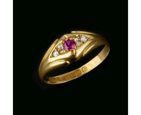 An 18 carat gold ruby and diamond ring, the central circular cut ruby between old cut diamonds, stamped 18 with full Birmingh