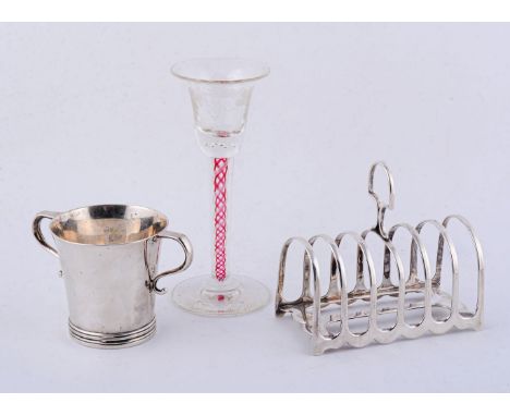 A silver six division toastrack by James Dixon &amp; Sons Ltd, Sheffield 1913, 11.5cm (4 1/2in) long; a twin handled cup by W