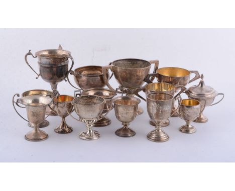 Twelve silver or silver coloured trophy cups, various dates 20th century, presentation engraved, 841g (27.05 oz) gross; and t