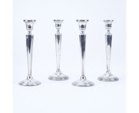 Two (2) Pair Weighted Sterling Silver Candlesticks. Signed sterling. Light dings, creases. Measures 9-7/8" H. Shipping $58.00