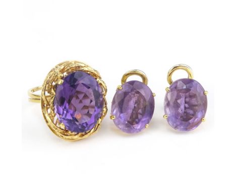 Vintage Oval Cut Amethyst and 18 Karat Yellow Gold Ring and Earring Suite. Amethyst in ring measures 18mm x 15mm. Unsigned. G