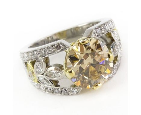 GIA Certified 4.04 Carat Fancy Brownish Yellow Diamond and Platinum Engagement Ring accented throughout with approx. 1.50 Car