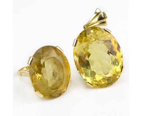 Large Oval Cut Yellow Topaz and 18 Karat Yellow Gold Ring and Pendant Suite. Ring Topaz measures 22mm x 18mm x 14mm. Pendant 